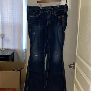 Dark wash bootcut jeans slightly distressed